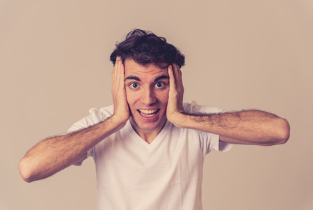 Portrait of Amazed excited funny Man achieving his goal or wining, laughing and making surprise gestures not believing his luck. In Happy face expression and Human emotions happiness.の写真素材