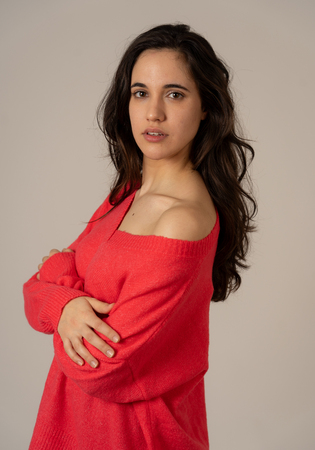 Portrait of young attractive latin woman with sensual look beautiful smile long dark hair and eyes. Brunette female modeling in casual stylish wear. In women natural Beauty Youth Care and Fashion.の写真素材