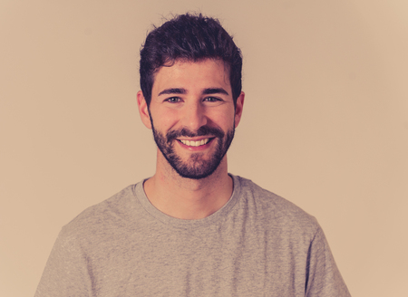 Portrait of attractive young model with happy face, beautiful smile and blue eyes. Handsome hipster bearded man in his 20s. Studio shot. In People, fashion and human facial expressions and emotions.の写真素材