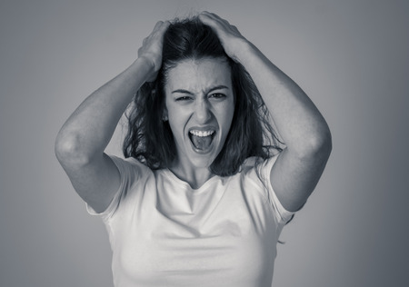Portrait of beautiful shocked woman winning or having great success with surprised and happy face feeling so happy. In human Expressions Positive Emotions and success celebration. copy space.の写真素材