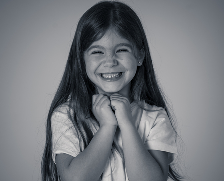 Close up portrait. Cute charming happy, excited, funny, cheerful young kid with a surprised face...