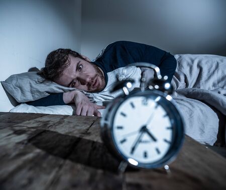 Mental health, Insomnia and sleeping disorders. Frustrated and hopeless sleepless man looking in...