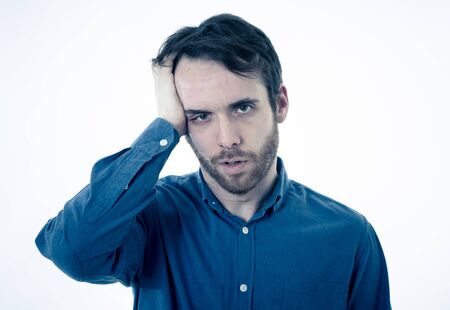 Portrait of a young bearded man looking worried and thoughtful suffering from migraines in great...