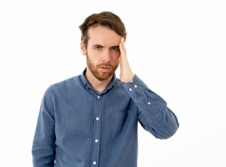 Portrait of a young bearded man looking worried and thoughtful suffering from migraines in great...
