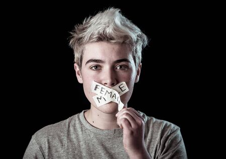 Transgender teenager with mouth sealed on tape about to break his silence about own gender identity...