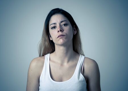 Facial expressions, emotions Anger. Young attractive caucasian woman with angry face. Looking mad and aggressive making furious gestures. Studio portrait in People adolescent mental health concept.の写真素材