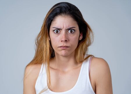 Young woman feeling scared and shocked making fear, anxiety gestures. Looking terrified and desperate. People and Human emotions and Violence and aggression social issues concept.の写真素材