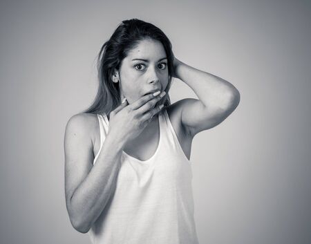 Beautiful young blonde woman with happy face making surprised gestures looking at something shocking...