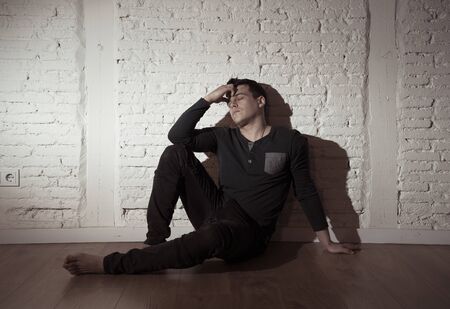 Portrait of sad depressed young man crying devastated feeling hurt suffering Depression in People,...