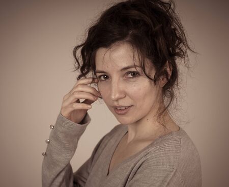 Half length portrait of young beautiful caucasian woman with happy face and beautiful smile posing and looking at the camera. Isolated on neutral background. In beauty, lifestyle and model concept.の写真素材