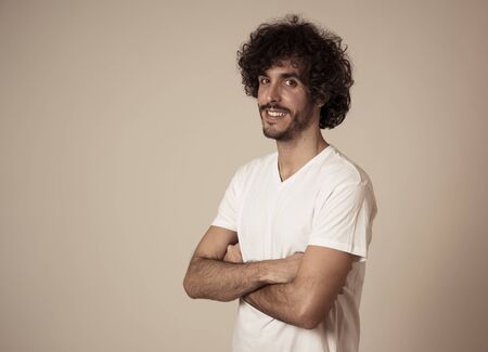 Portrait of young latin man with stylish hair and beautiful smile. Millennial hipster male feeling...
