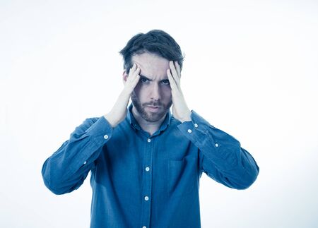 Portrait of a young bearded man looking worried and thoughtful suffering from migraines in great...