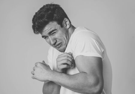 Portrait of Handsome latin young man in shock with a scared expression on his face making frightened...