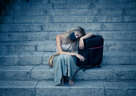 Summer Travel during virus and tourism. Sad Tourist woman with luggage and facemask could not get abroad over summer holidays.の写真素材