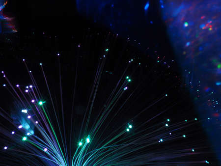 Fiber optic lamp, colored optical fibers, glowing lights at night, party futuristic neon color style, new retro, colored lights like starsの写真素材