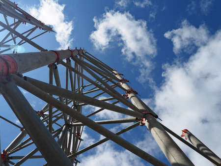 view of the structure from below, looking from above, sky with nice clouds, clear sky, and sun rays...