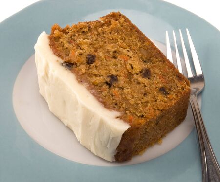 slice of carrot cake with cream cheese icingの写真素材