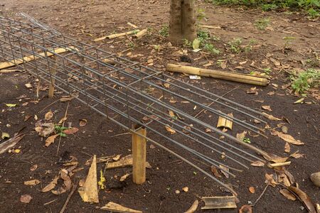 Deformed steel fastened with steel wire, Wire truss scheme for making beam structures. Construction rebar steel work reinforcement in concrete structur. Using steel wire for securing steel bars.の写真素材
