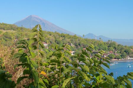 Beautiful view of Mount Agung and Mount Batur volcanos from a boat at Amed Beach, Bali, Indonesia.の写真素材