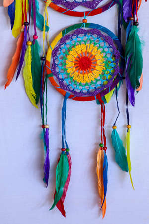 Beautiful multicolored handmade dreamcatcher on white background.の写真素材
