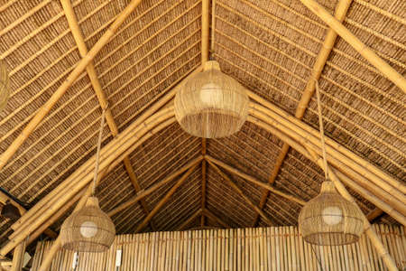 Traditional style chandelier. made from rattan wood. Ecological house made of natural materials