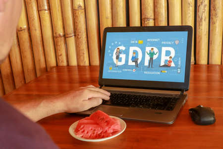 people using computer laptop with text GDPR or General Data Protection Regulation secure , star and...