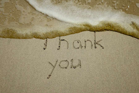 thank you, gratitude concept, beautiful card, word written on sand beach.の写真素材