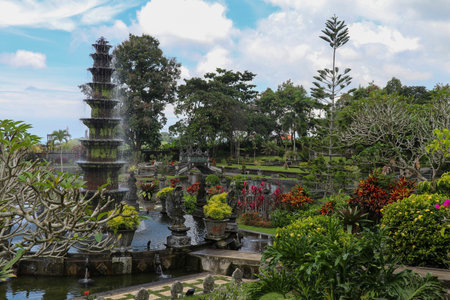 Eleven level fountain in the tropical park Tirta Gangga. 11 tiered lotus fountain symbol of Tirta Gangga, Bali, Indonesia. The main fountain in the park of Hindu Temple Tirta Ganggaの写真素材