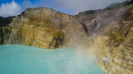 A drone capture of an early morning over the Kelimutu Lakes on Flores, Indonesia. The volcanic lakes...