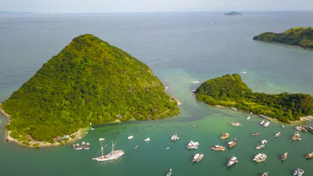 Aerial view group of traditional phinisi sailing around Padar Island Labuan Bajo.