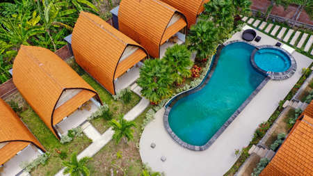 An aerial top down view of luxury bungalow house with swimming poolの写真素材