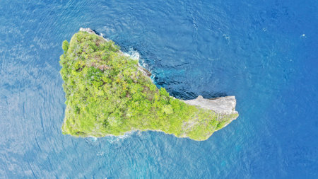 Rocky islet in the Indian oceanOcean. Aerial footage of isolated island, washed with sea waters. High quality 4k footageの写真素材