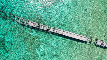 The top down view of the magnificent Old bridge at Summerville beach. The wooden planks are...