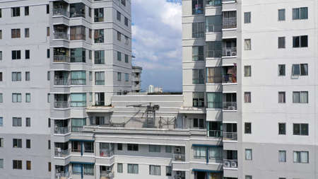 Close up of a residental estate. two modern residential high rise buildings. Blue sky between...