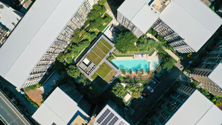 Top down of modern condominium with swimming pool and flat building in Bangkok cityの写真素材