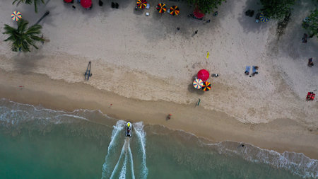 Top view of jet ski ride in Patong Beach. Jet ski parking on the Beach. Happy day and enjoy with a...