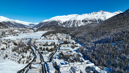 St Moritz, Switzerland: Aerial drone photography of the Saint Moritz ski resort village and frozen lake on a cloudy winter day in the Engadine valley in Canton Graubunden in the Swiss alps.の写真素材