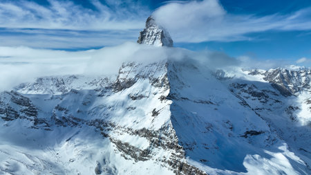 the amazing Matterhorn and surrounding mountains in the Swiss Alps with fantastic cloud formations