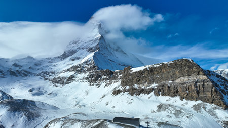 Matterhorn, Switzerland. Winter mountain landscape. A place for skiing. Zermatt ski resort. High rocks and snow. Mountain scene in Switzerland. Photo for postcards, backgrounds, wallpapersの写真素材