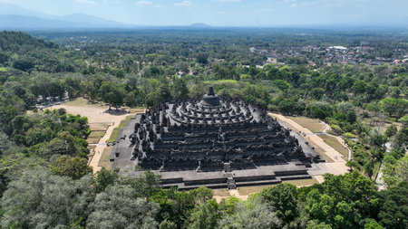 A breathtaking aerial view of Borobudur, the worlds largest Buddhist temple, rising majestically...
