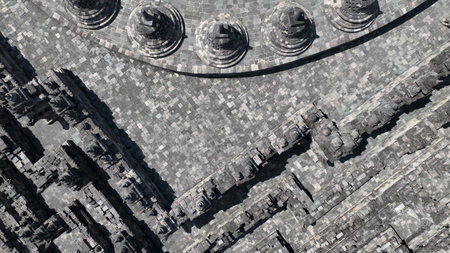 A close-up aerial view reveals the intricate stonework and geometric precision of Borobudur terraces, showcasing the temple harmonious blend of spiritual symbolism and architectural geniusの写真素材