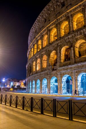 This long-exposure photograph shows details of the ruins of the great Colosseum Romando, as well as the street that passes by.の写真素材