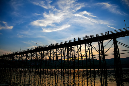 The silhouette of the old wooden bridge in Sangklaburi, Bridge across the river and Wood bridge Mon bridgeat sangklaburi, kanchanaburiの写真素材