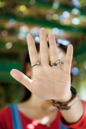 Beautiful celebrity saying no photos, Woman making stop gesture with her hand