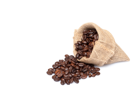 roasted coffee beans in burlap sack, coffee beans in burlap bag isolated on white backgroud.の写真素材