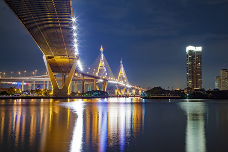 Under view of Bhumibol Bridge in Bangkok Thailand, also known as the Industrial Ring Road Bridge. The bridge crosses the Chao Phraya River., On Night Sceneの写真素材