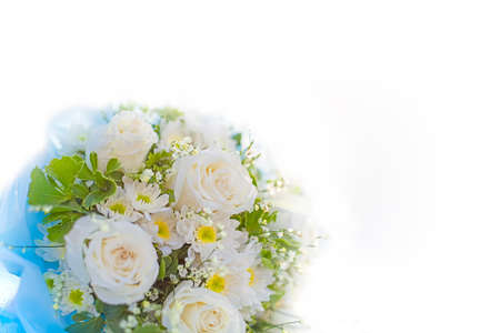 Soft focus white wedding bouquet on white background.の写真素材