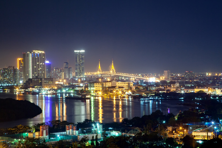 Bangkok cityscape. Bangkok night view of Bhumibol Bridge on Chao Phraya river and business district.の写真素材
