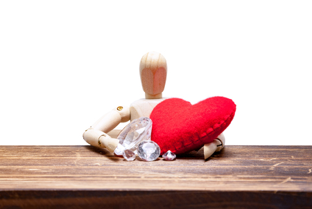 wooden dummies choose between diamond or heart, isolated on white background., love concept for valentines day.の写真素材