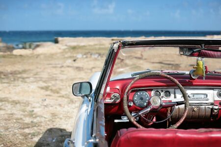 cuban vintage car parked on the seacost in havana